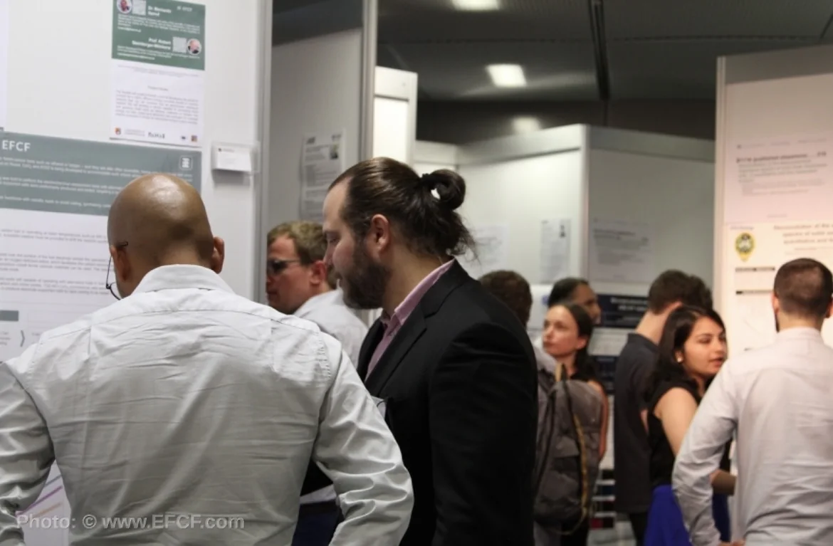 Researchers and attendees meeting at a scientific conference